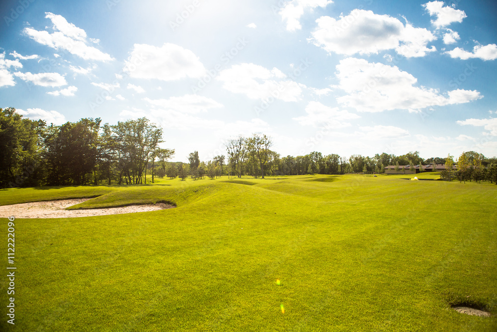 Sand bunkers at beautiful golf course at sunset, sunrise time. Nice nature and environment with blue sky and white clouds. Sand bunkers at beautiful golf course at sunset, sunrise time. Nice nature and environment with blue sky and white clouds.