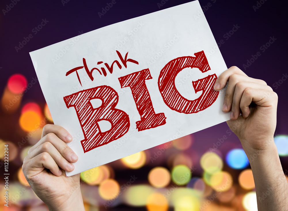 Fotografie Think Big placard with night lights on background