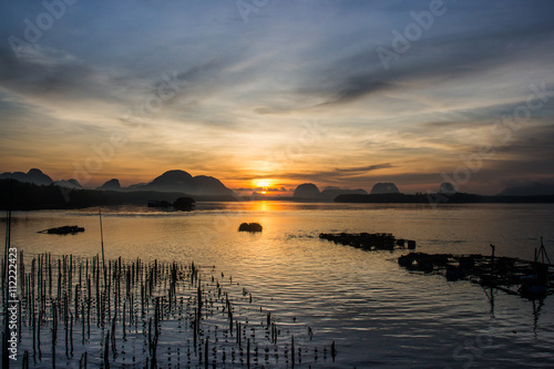 Landscape of beautiful sunrise at fisherman village in Thailand