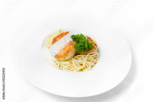 Spaghetti with chicken meatballs on a white background