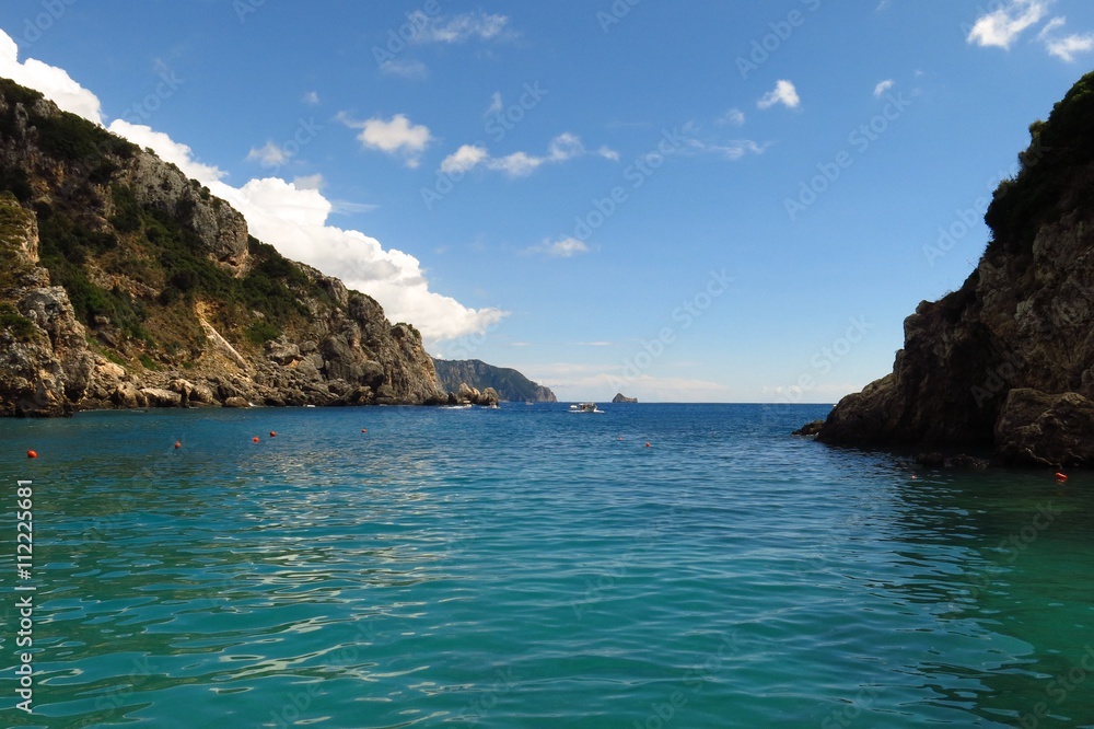 peaceful cove turquoise water beneath blue sky with copy space peaceful cove turquoise water beneath blue sky with copy space