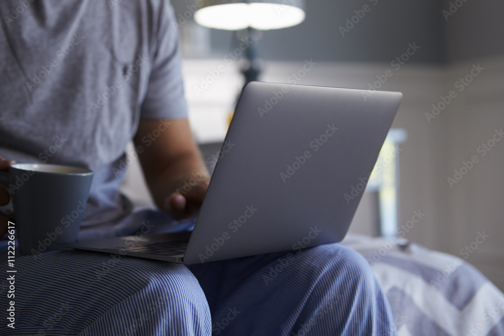 Close Up Of Man In Pajamas Using Laptop Computer Close Up Of Man In Pajamas Using Laptop Computer