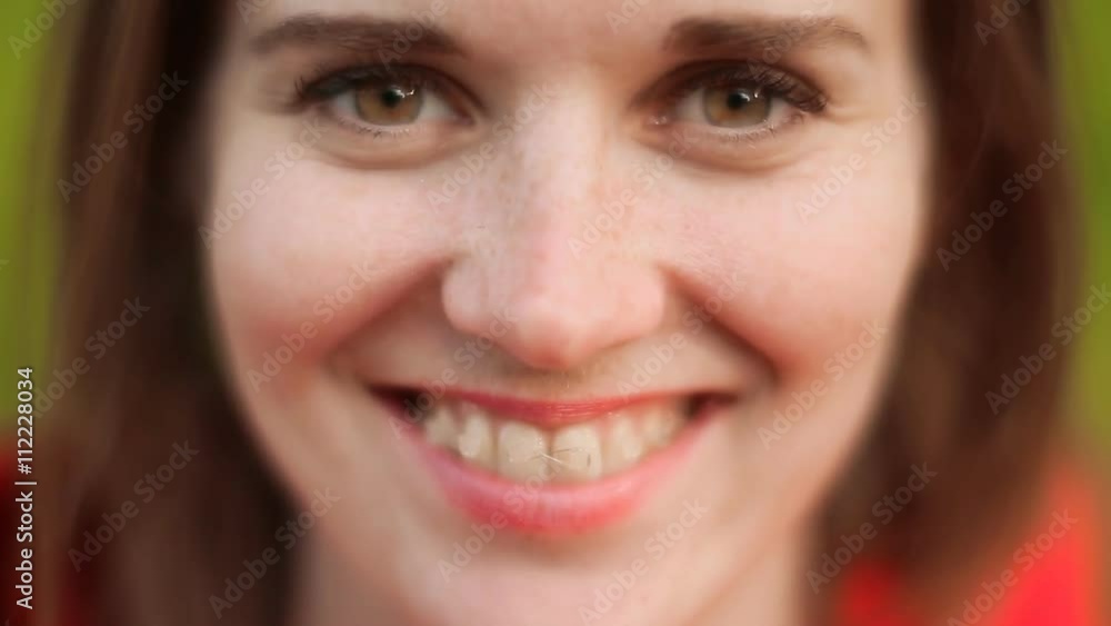 Young smiling woman with freckles and teeth braces Young smiling woman with freckles and teeth braces
