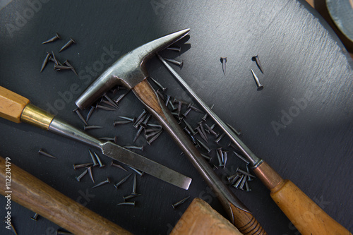 Traditional tools of upholsterer on a table