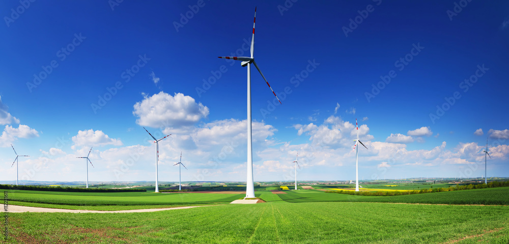 Wind turbines in front of blue sky Wind turbines in front of blue sky