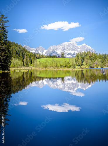 Fototapeta Naklejka Na Ścianę i Meble -  Wilder Kaiser reflecting in mountain lake, Kitzbühel, Tyrol, Austria