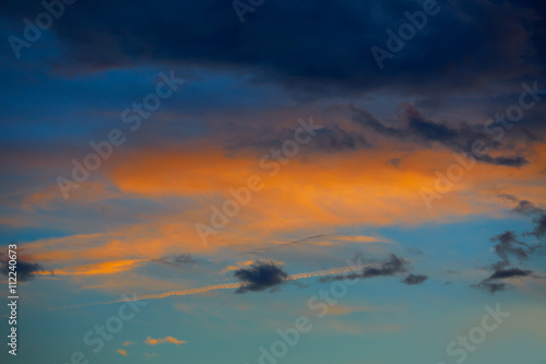 Sunset orange clouds in a blue sky