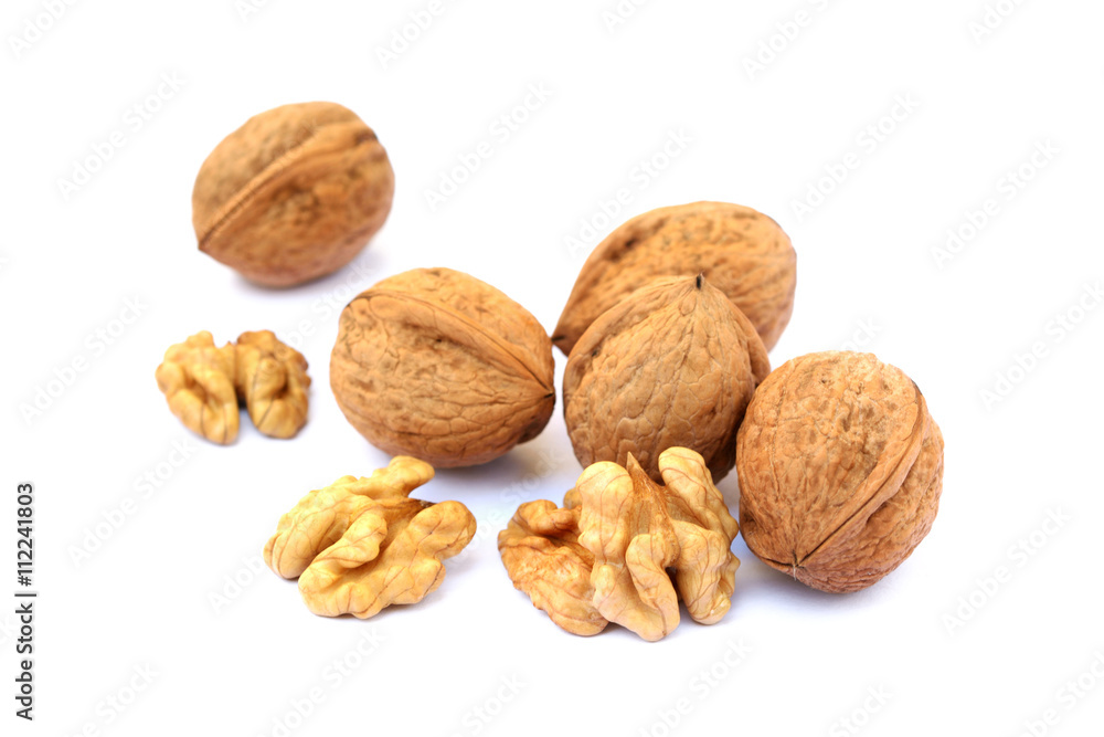 Fresh walnuts with a shell isolated on white background Fresh walnuts with a shell isolated on white background