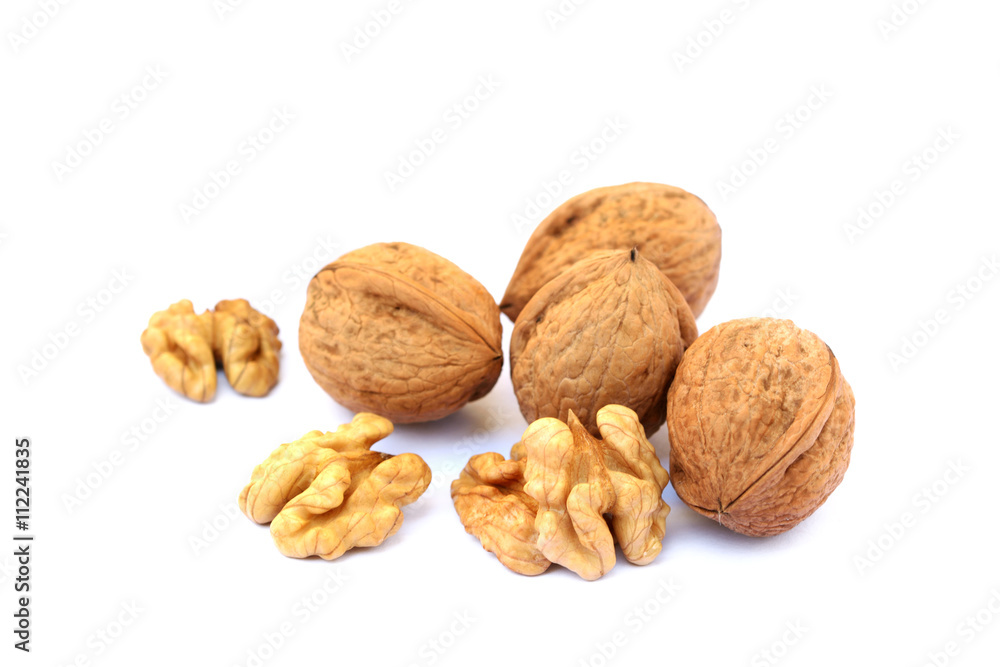 Fresh walnuts with a shell isolated on white background Fresh walnuts with a shell isolated on white background