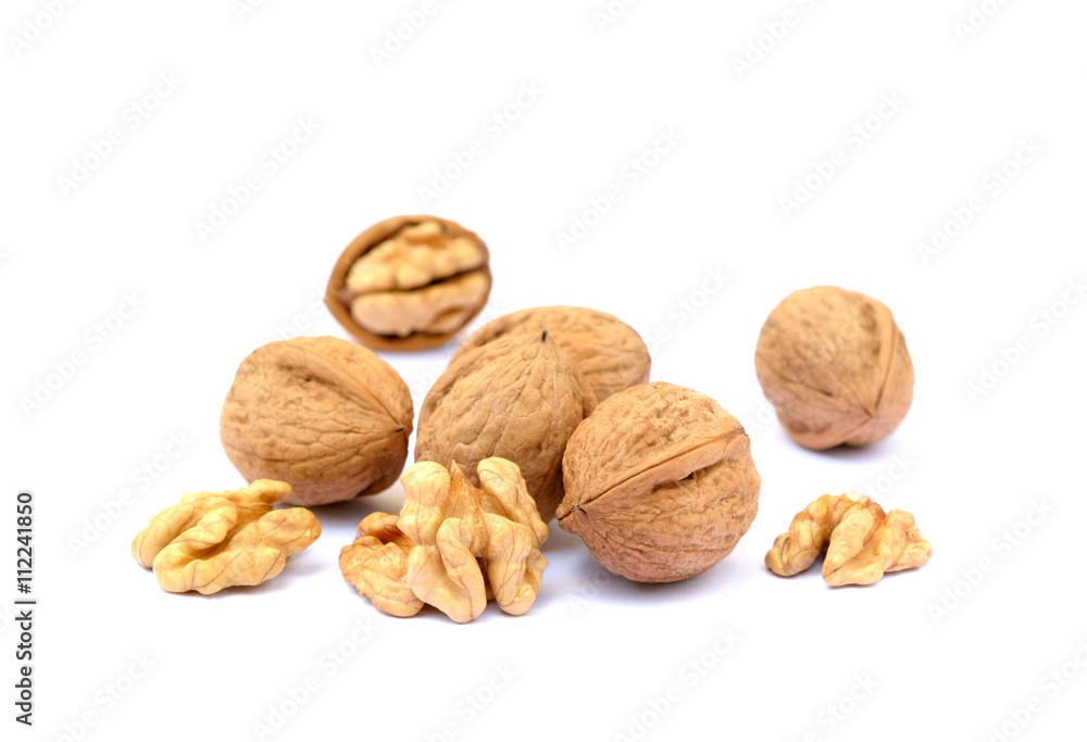 Fresh walnuts with a shell isolated on white background Fresh walnuts with a shell isolated on white background
