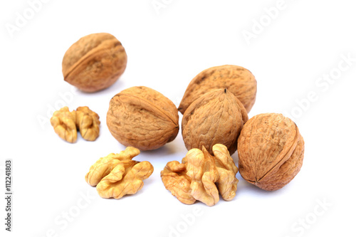 Fresh walnuts with a shell isolated on white background © george3973