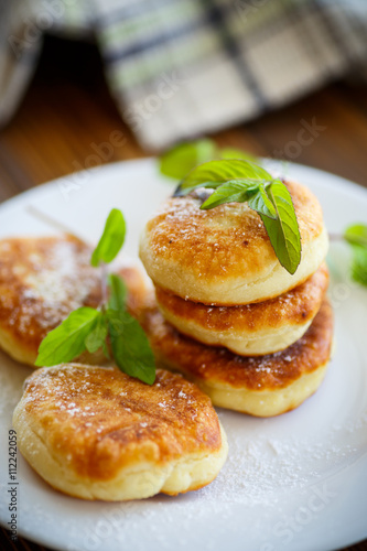 sweet cheese pancakes on a plate 
