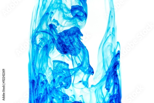 Abstract pattern falling into the water drop of blue ink - cyan ink dissolved in water
 photo