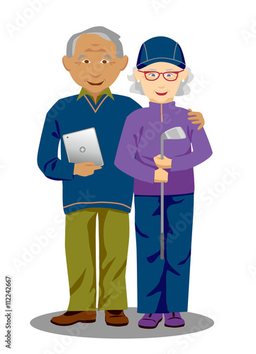 Active, elderly interracial couple holding tablet computer and golf club photo