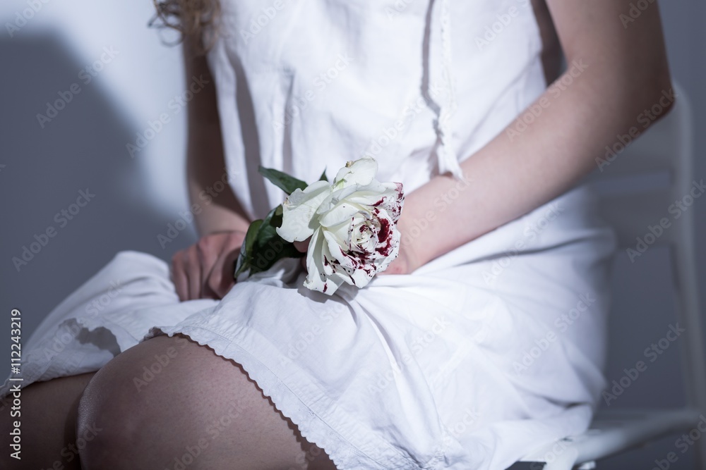 Symbolic farewell to her lost innocence Symbolic farewell to her lost innocence