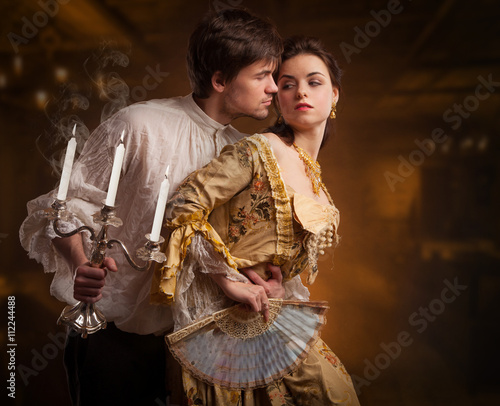 Beautiful couple woman and man in medieval clothes