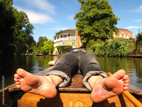 Vászonkép barefoot on boat in river Oxford England