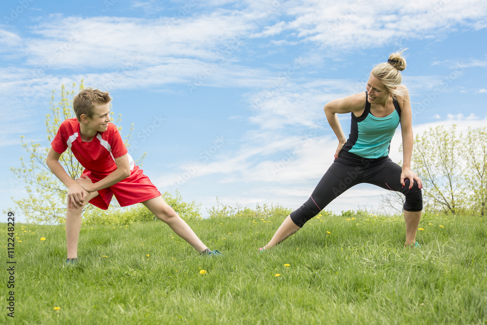 Family, mother and son are running or jogging for sport outdoors Family, mother and son are running or jogging for sport outdoors
