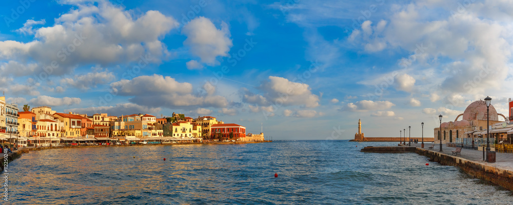 Panoramic view of old harbour of Chania with Lighthouse and Kucuk Hasan Pasha Mosque in summer morning, Crete, Greece