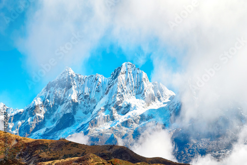 Peaks of mountains, covered by snow. photo