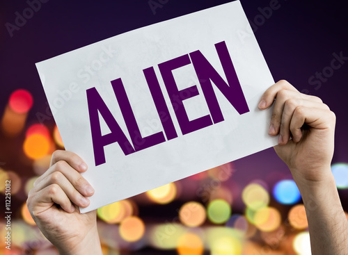 Alien placard with night lights on background