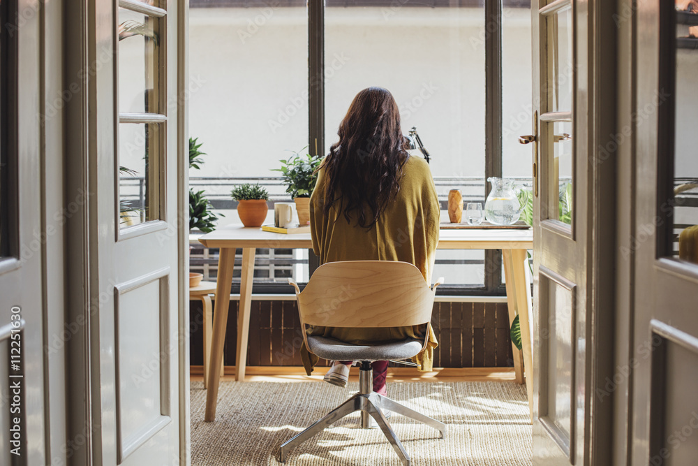 Woman sitting at desk Woman sitting at desk
