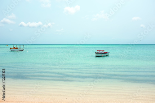 Fototapeta Naklejka Na Ścianę i Meble -  Little old fishing boats at Aruba island in the Caribbean sea