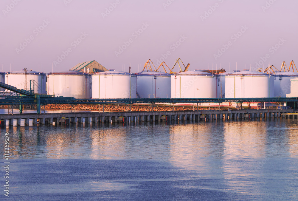Oil bunkers at the Marina in Ventspils at sunset
