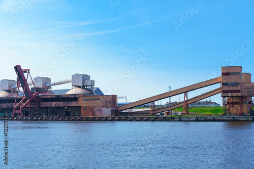 Loading cranes and factory at the Marina in Ventspils photo