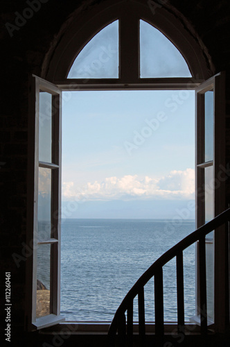 Looking Out an Open  Window to the Blue Ocean and Sky © egiadone