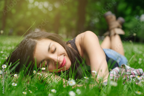 Girl resting in meadow