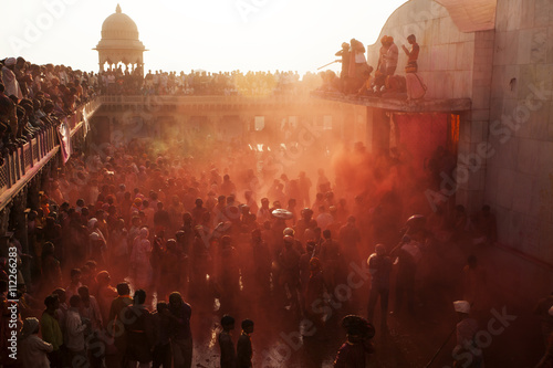 Holi festival enjoying by a crowd in Krishna Temple of Uttar Pradesh,India photo