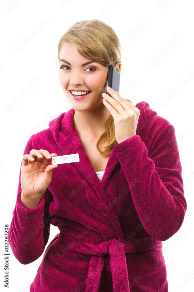 Happy woman with phone informing someone about positive pregnancy test Happy woman with phone informing someone about positive pregnancy test