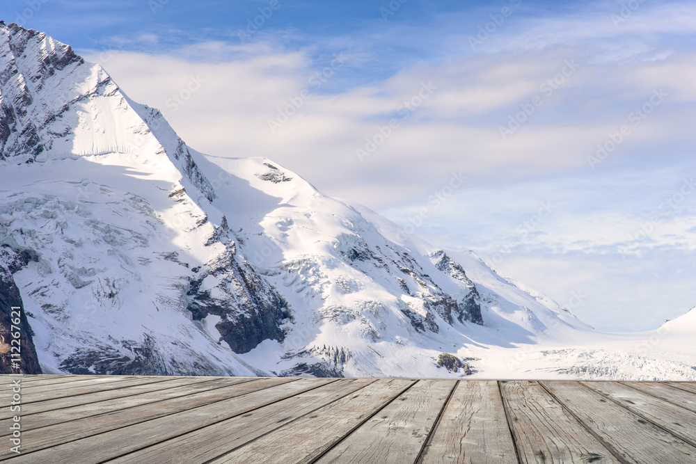 Empty wooden terrace with Mountain view of Franz Josefs Hohe Gla Empty wooden terrace with Mountain view of Franz Josefs Hohe Gla