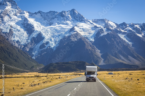 Canvas Print campervan on road with mountain view