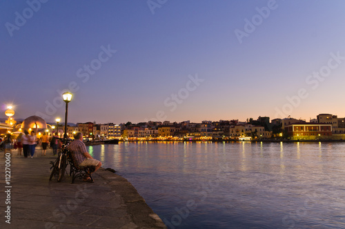 Panoramic view of the Chania harbor promenade at night, Crete, Greece