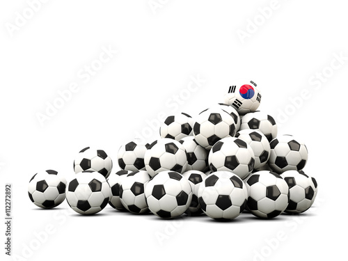 Pile of soccer balls with flag of korea south