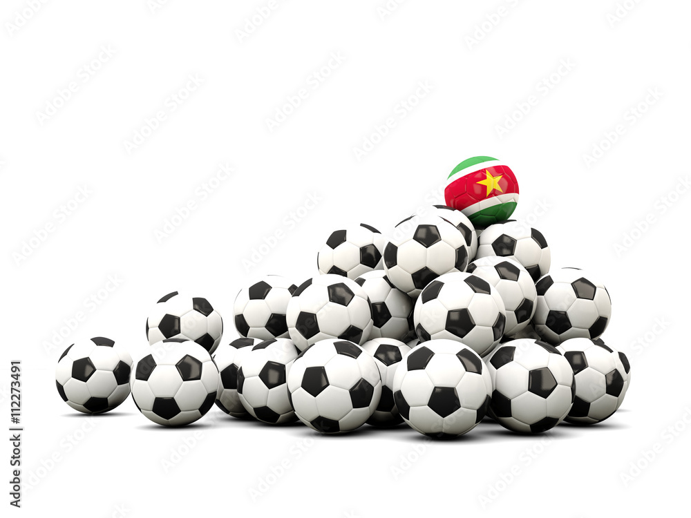 Pile of soccer balls with flag of suriname Pile of soccer balls with flag of suriname