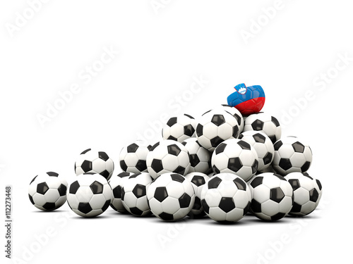Pile of soccer balls with flag of slovenia