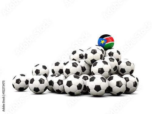 Pile of soccer balls with flag of south sudan