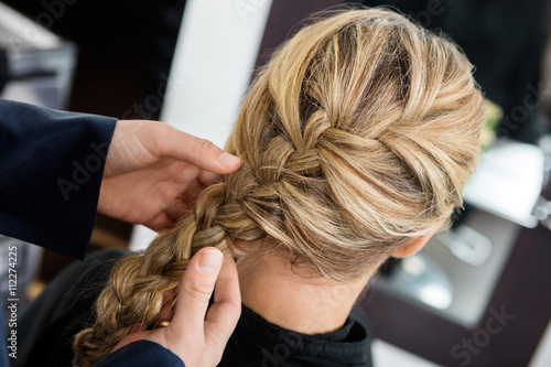 Photos Closeup Of Hairstylist's Hands Braiding Client's Hair