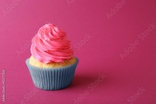 Birthday cupcake on pink background