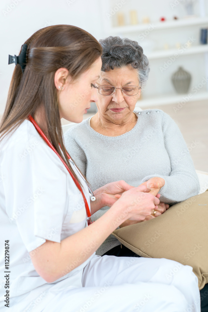 Fototapeta premium Checking a senior patient's hand