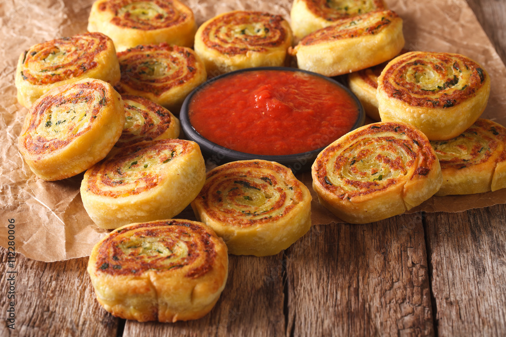 Fried spicy potato rolls and tomato sauce closeup. horizontal
Fried spicy potato rolls and tomato sauce closeup. horizontal