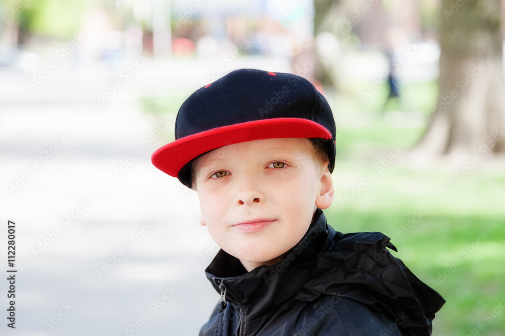 Portrait of a boy in a cap looking at the camera Portrait of a boy in a cap looking at the camera