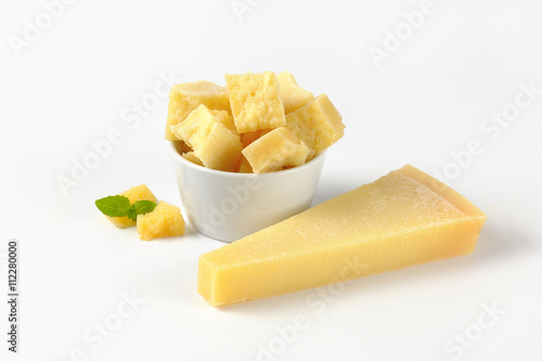 bowl and wedge of parmesan cheese