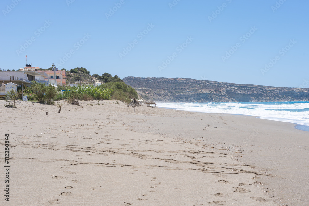 Komos beach in Kalamaki situated in the south-central of Crete. The village is close to the Ida mountains, the beach is on the west side between the Messera plain and Matala in the south Komos beach in Kalamaki situated in the south-central of Crete. The village is close to the Ida mountains, the beach is on the west side between the Messera plain and Matala in the south