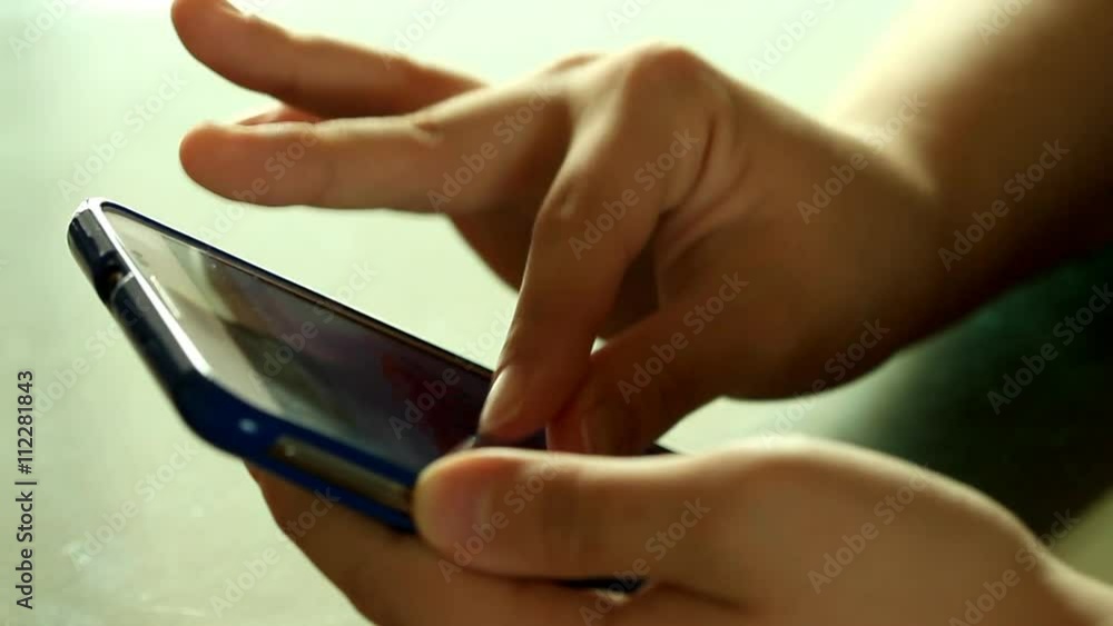 Fingers using smart phone 