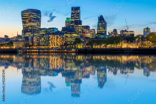Stunning London cityscape after sunset with its reflection from river Thames
