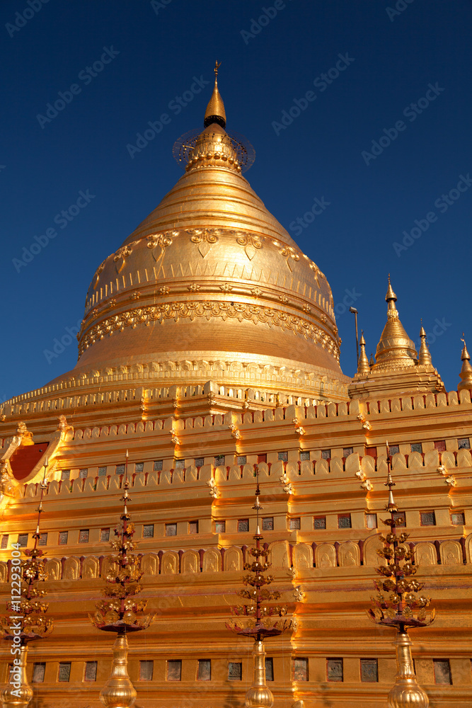 Shwezigon Pagoda in Bagan, Myanmar (former Burma) at sunrise. Shwezigon Pagoda in Bagan, Myanmar (former Burma) at sunrise.